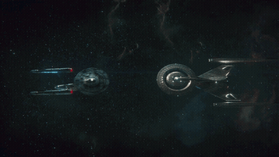 Two Spaceships Flying In Dark GIF