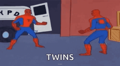 Two Spider-Man Are Standing Next To Each Other In A Room And Fighting . GIF