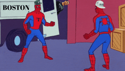 Two Spidermans Standing In Front Of Boston Sign GIF