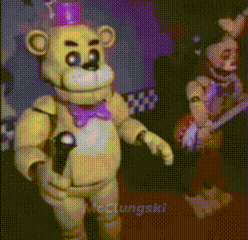 Two Stuffed Animals Are Dancing In A Room With A Purple Background . GIF