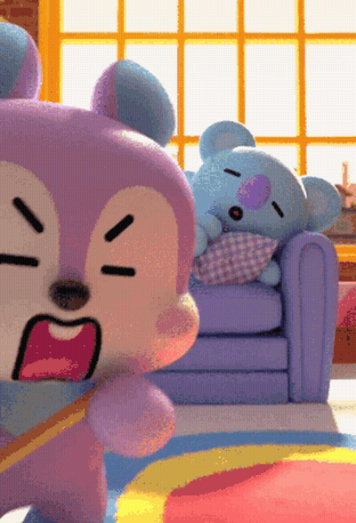 Two Stuffed Animals Are Sitting On A Couch And One Is Sleeping GIF