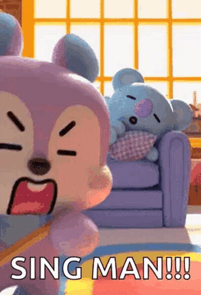 Two Stuffed Animals Are Sitting On A Couch And One Is Yawning . GIF