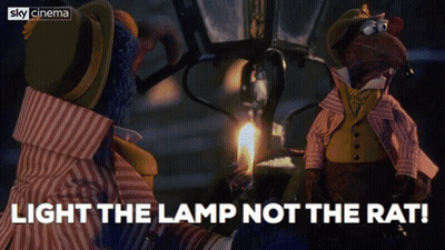 Two Stuffed Animals Are Standing Next To A Lamp With The Words Light The Lamp Not The Rat Below Them GIF