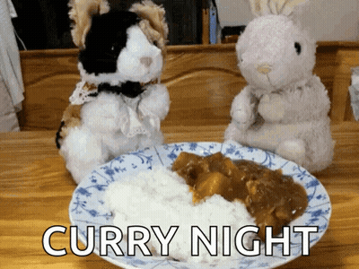 Two Stuffed Animals Are Standing Next To A Plate Of Curry GIF