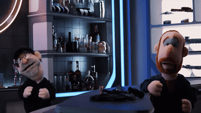 two stuffed animals are standing next to each other in a room