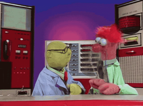Two Stuffed Animals Are Talking In Front Of A Machine That Says Computer On The Front GIF