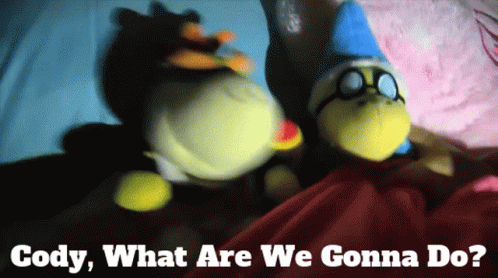 Two Stuffed Animals Laying On Bed With Cody What Are We Gonna Do GIF