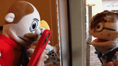 Two Stuffed Animals Looking At Phone GIF