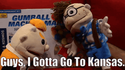 Two Stuffed Animals Next To Gumball Machine Box GIF