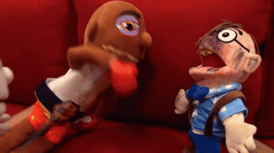 Two Stuffed Animals On Red Couch GIF