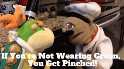 Two Stuffed Animals Saying If You're Not Wearing Green You Get Pinched GIF