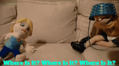 Two Stuffed Dolls Are Sitting On A Couch With The Words Where Is It GIF