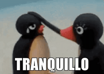 Two Stuffed Penguins Are Touching Each Other 'S Faces And The Words Tranquilo Are Written Above Them . GIF
