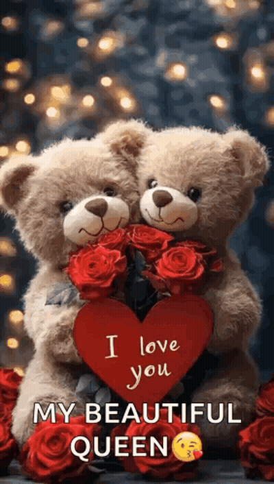 Two Teddy Bears Are Hugging Each Other And Holding A Red Heart . GIF