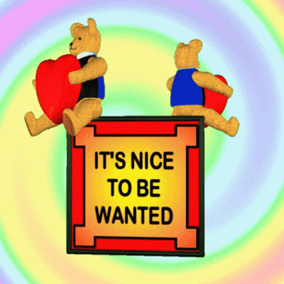 Two Teddy Bears Holding Hearts Saying It's Nice to Be Wanted