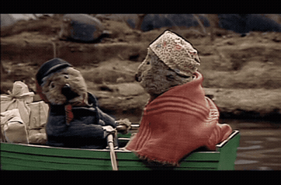 Two Teddy Bears In A Green Boat GIF