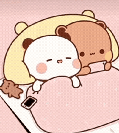 Two Teddy Bears Laying On Bed With Cell Phone GIF