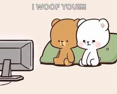 Two Teddy Bears Sitting In Front Of Television GIF