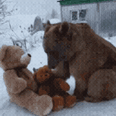 Two Teddy Bears Sitting In Snow GIF