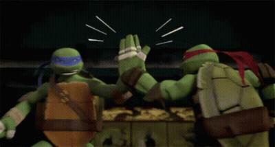 Two Teenage Mutant Ninja Turtles Are Fighting Each Other In A Dark Room . GIF