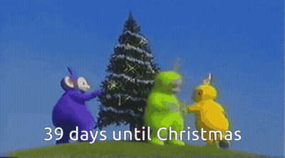 Two Teletubbies Beside Christmas Tree Saying 39 Days Until Christmas GIF