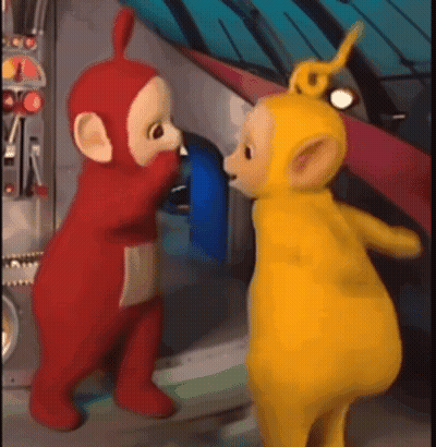 Two Teletubbies Standing In A Room GIF