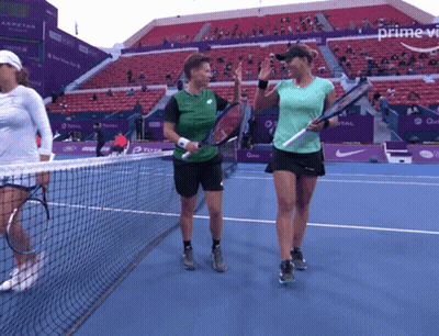Two Tennis Players On A Court With The Word Prime In The Upper Right Corner GIF