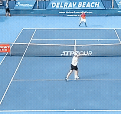 Two Tennis Players On Court With Delray Beach Banner GIF