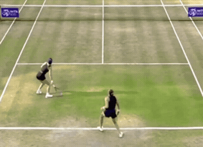 Two Tennis Players On Court With WTA Logo GIF