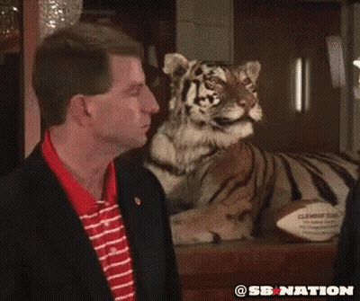 Two Texas A&M Football Players Talking On Field GIF