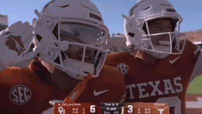 Two Texas Football Players Celebrating Score GIF