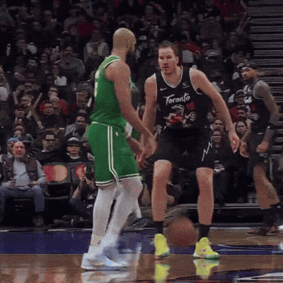Two Toronto Raptors Basketball Players Playing