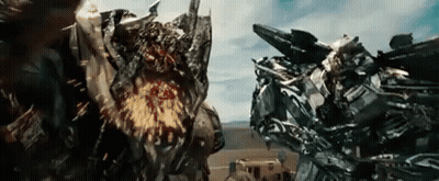 Two Transformers Fighting In Movie Scene GIF