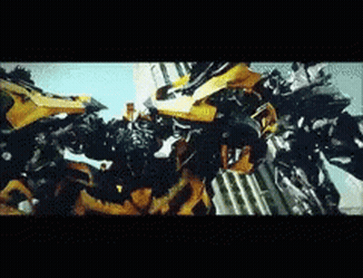 Two Transformers Fighting Yellow One GIF