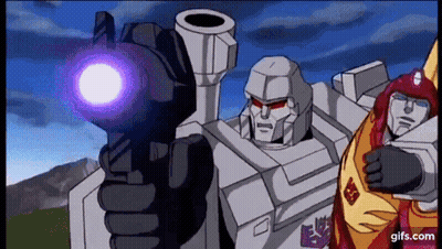 Two Transformers One Pointing Gun At Camera GIF
