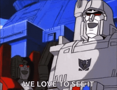 Two Transformers Standing Together GIF