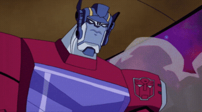 Two Transformers Standing Together One With Chest Shield GIF