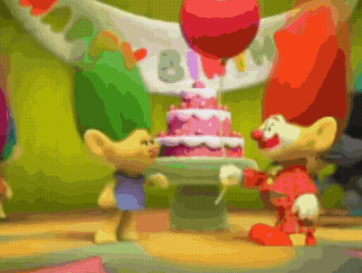 Two Trolls Standing In Front Of A Birthday Cake With Balloons And A Banner That Says Birthday GIF