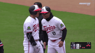 Two Twins Baseball Players Talking On The Field GIF