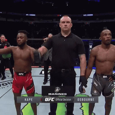 Two Ufc Fighters Are Standing Next To Each Other On The Ring GIF
