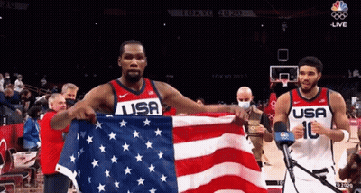 Two USA Basketball Players Holding American Flag GIF
