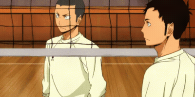 Two Volleyball Players Are Standing Next To Each Other On A Court . GIF