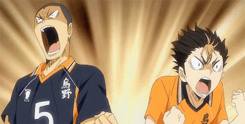 Two Volleyball Players Are Standing Next To Each Other With Their Mouths Open . GIF