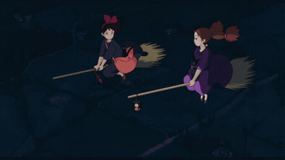 Two Witches Flying On Brooms In Night Sky GIF