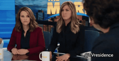 Two Women And Man At Table With Mr. Sign GIF