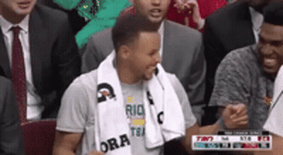Two Women And Man In SLS Shirt In Stadium GIF