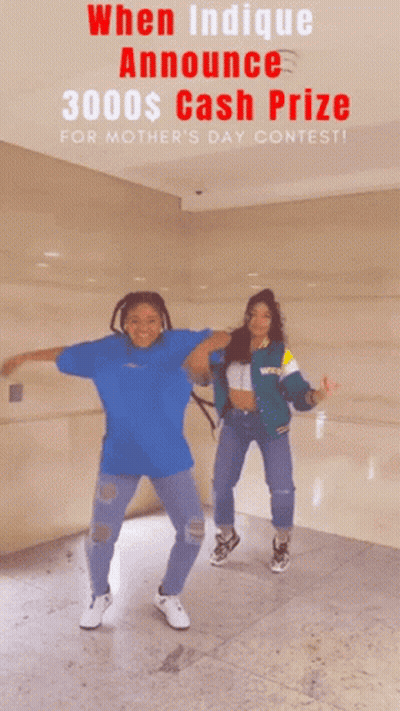 Two Women Are Dancing In Front Of A Sign That Says 3000 $ Cash Prize For Mother 'S Day Contest GIF