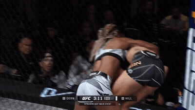 Two Women Are Fighting In A Boxing Ring With The Ufc 3:11 In The Corner GIF