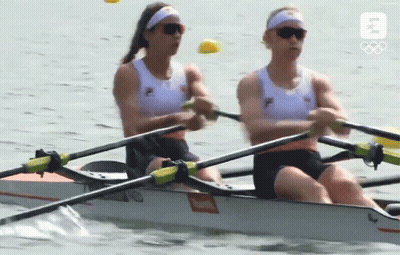 Two Women Are In A Rowing Boat With The Letter B On The Bottom GIF