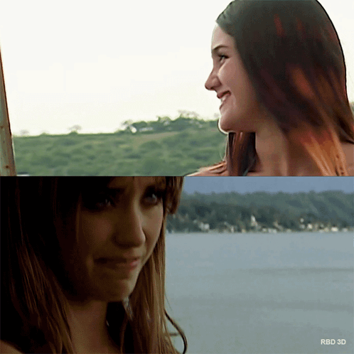 Two Women Are Looking At Each Other With The Words Rbd 3D On The Bottom Right GIF